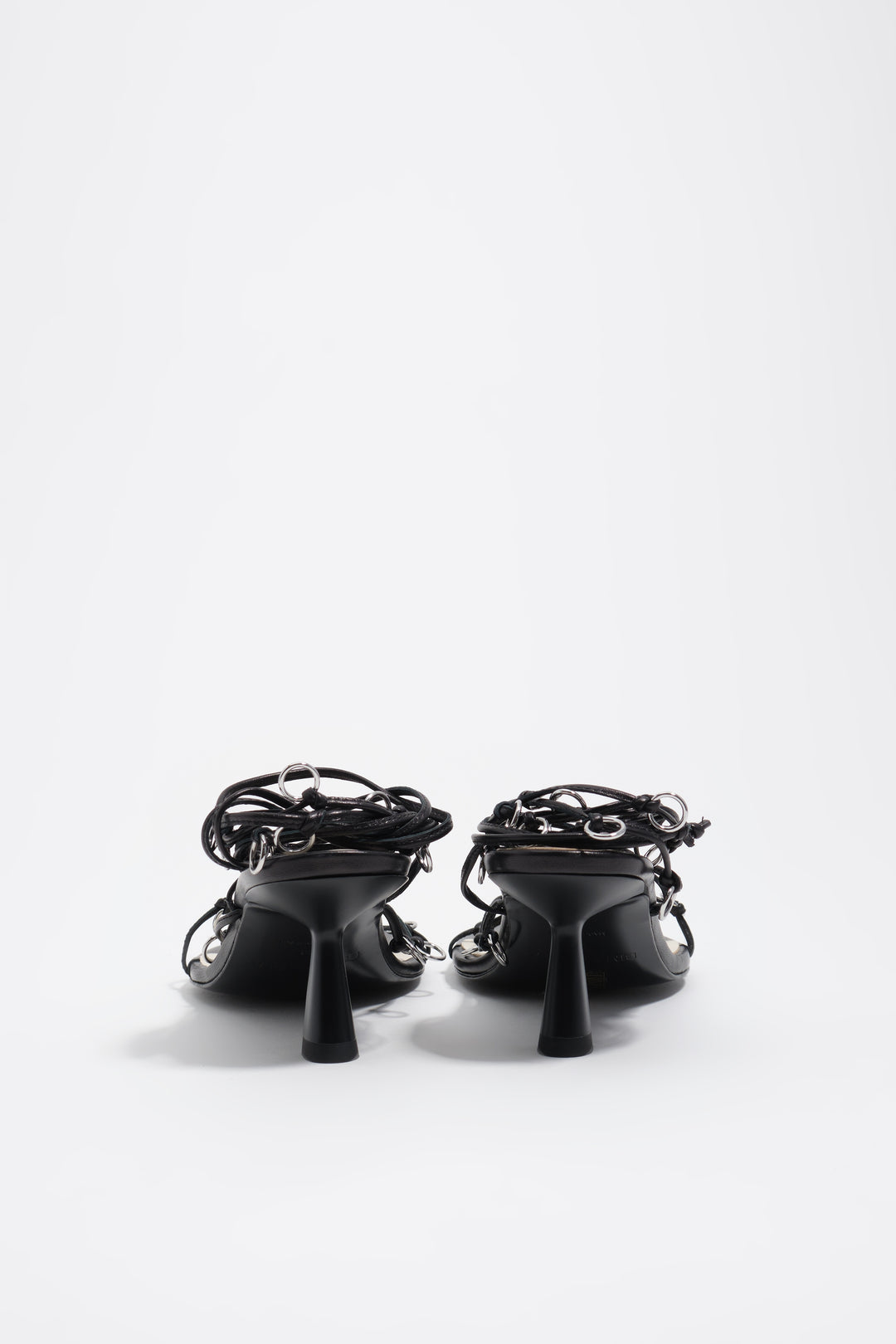 Black leather heeled sandal with piercings