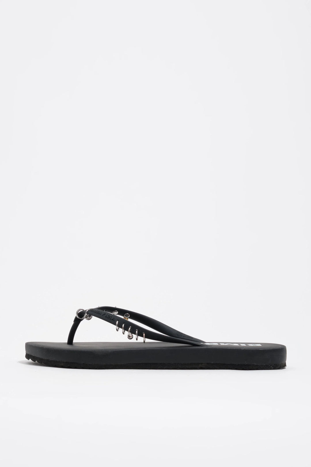Black flip-flop with piercings