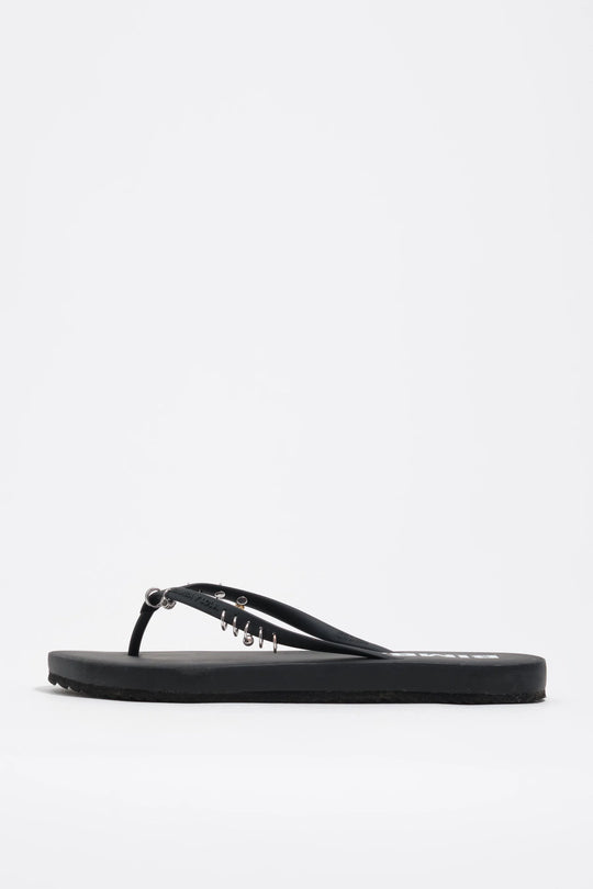 Black flip-flop with piercings