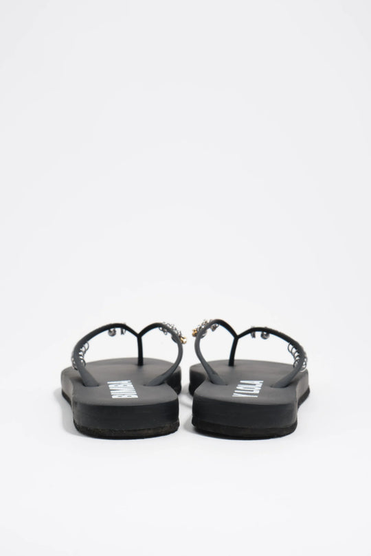 Black flip-flop with piercings