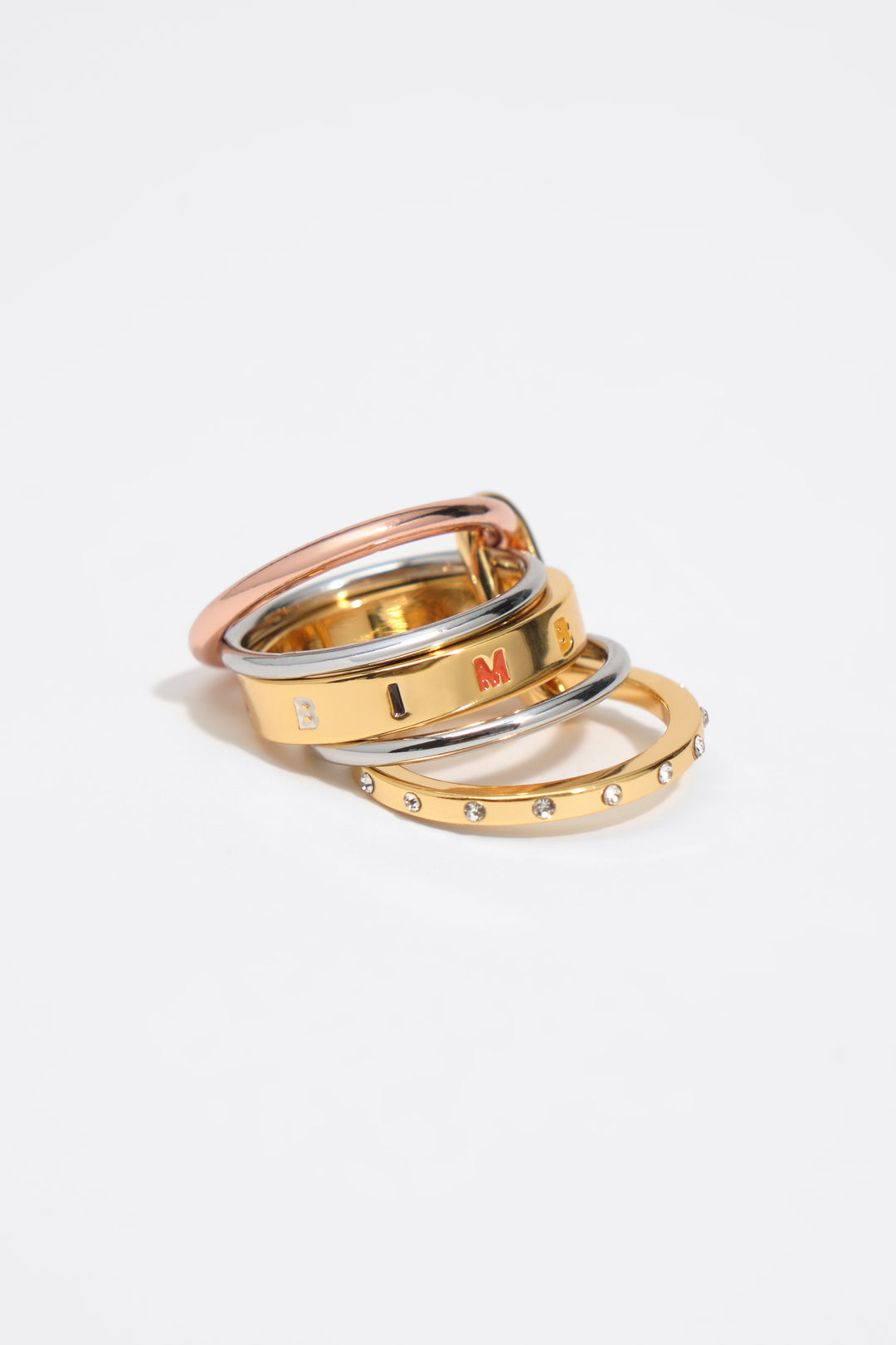 Ring with multi-gold bands and multicolored logo crystals