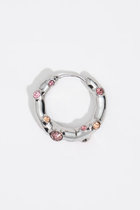 Silver textured metal hoop earrings with pink crystals