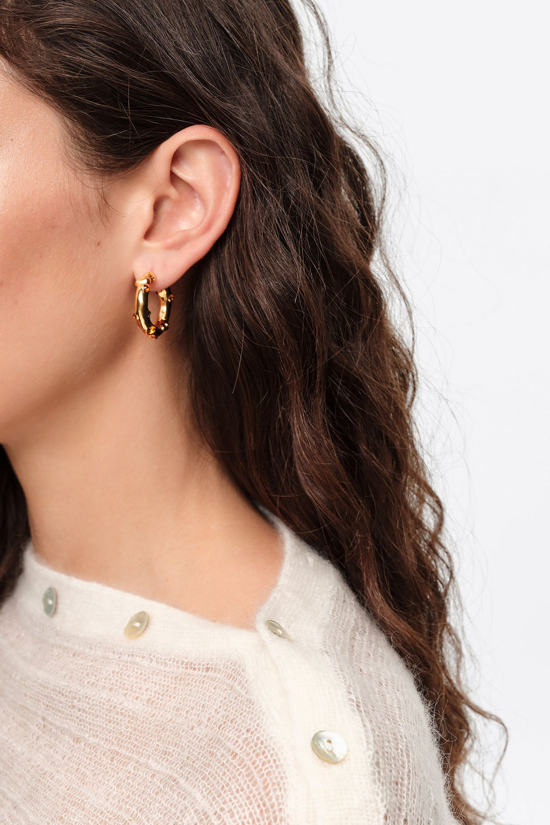 Hoop earrings with topaz crystals and gold-textured metal