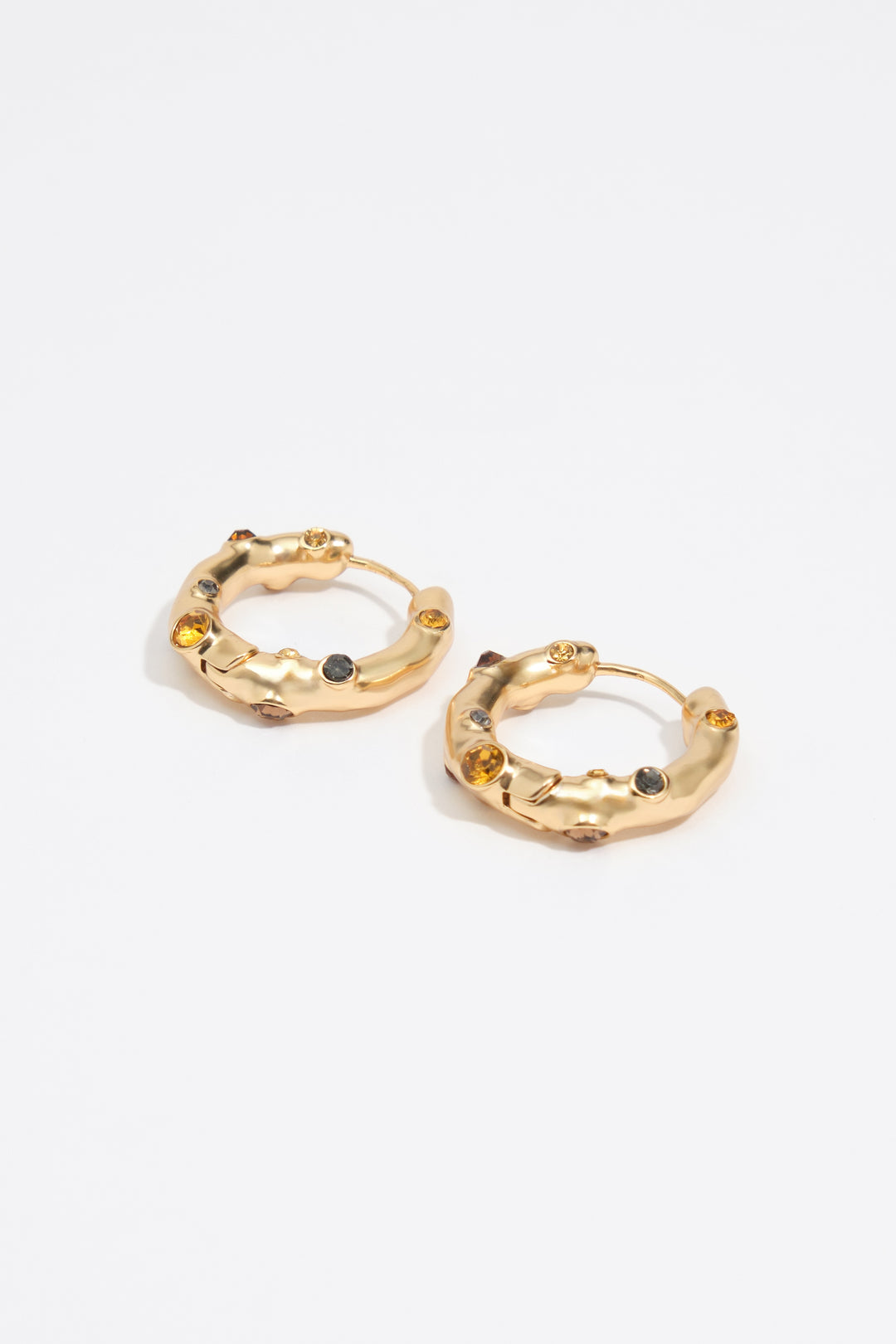 Hoop earrings with topaz crystals and gold-textured metal
