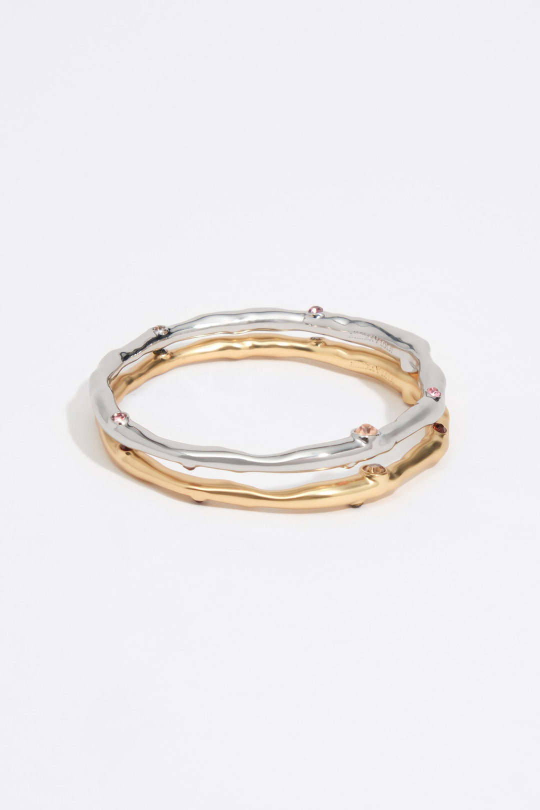 Set of 2 gold and silver textured metal bracelets with crystals