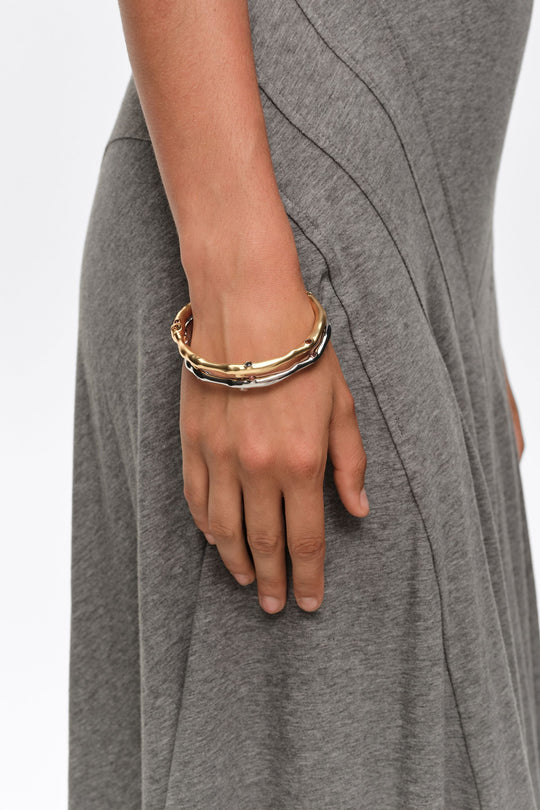 Set of 2 gold and silver textured metal bracelets with crystals