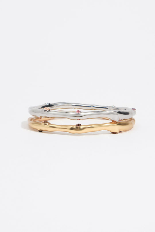 Set of 2 gold and silver textured metal bracelets with crystals