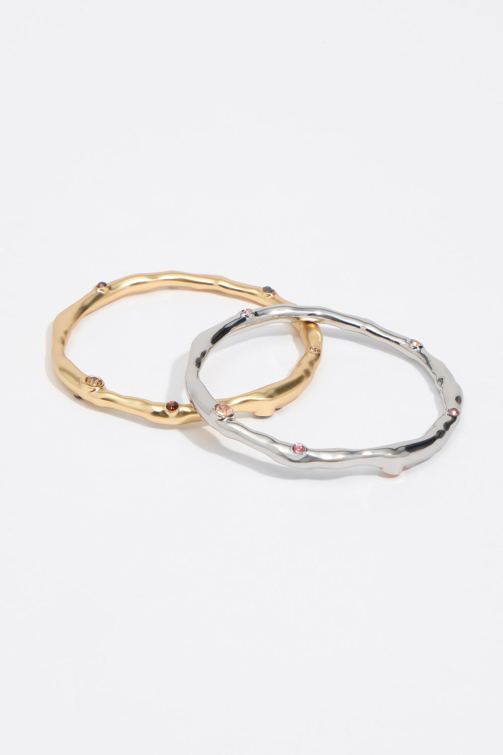 Set of 2 gold and silver textured metal bracelets with crystals
