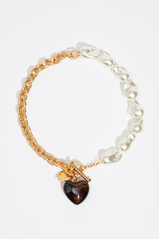 Chain and pearl necklace with amber resin heart