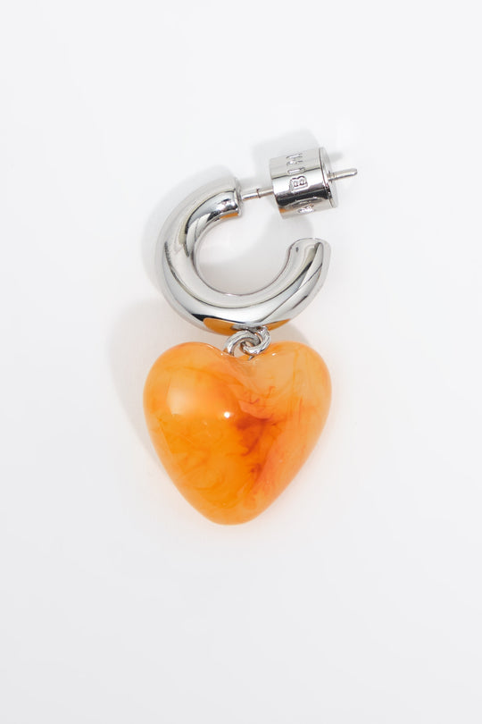 Silver hoop earrings with yellow resin heart