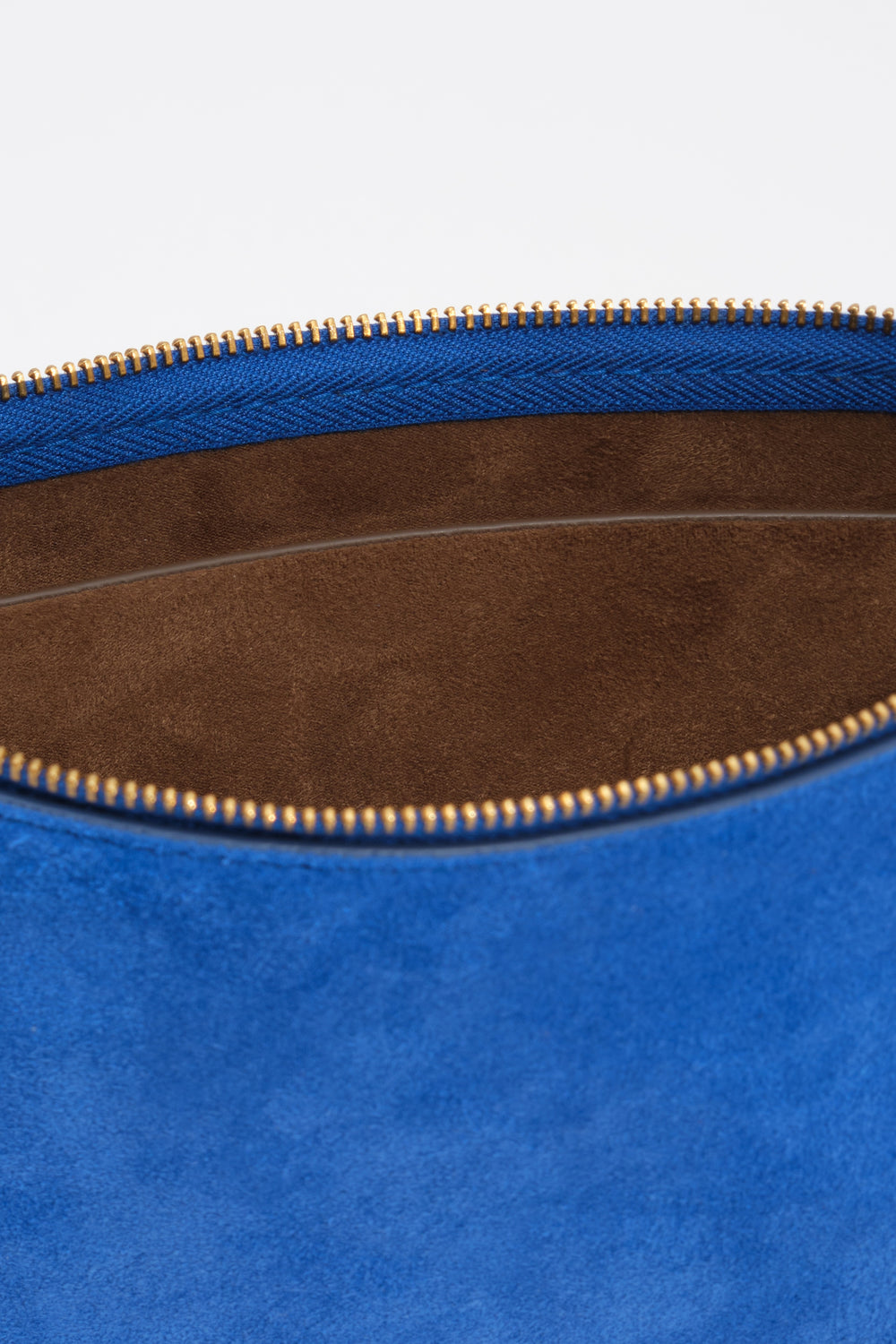 Small electric blue suede clutch bag