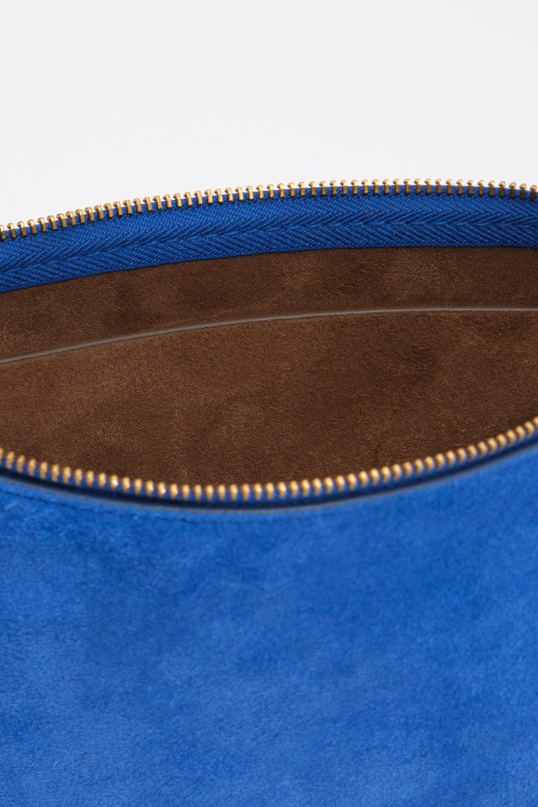 Small electric blue suede clutch bag