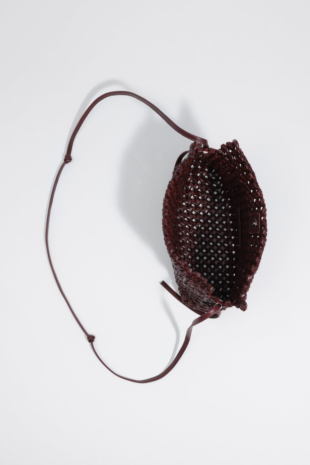 Small burgundy plaited leather crossbody bag