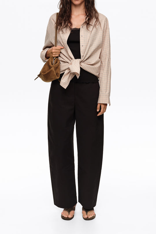 Black barrel trousers with decorative stitching