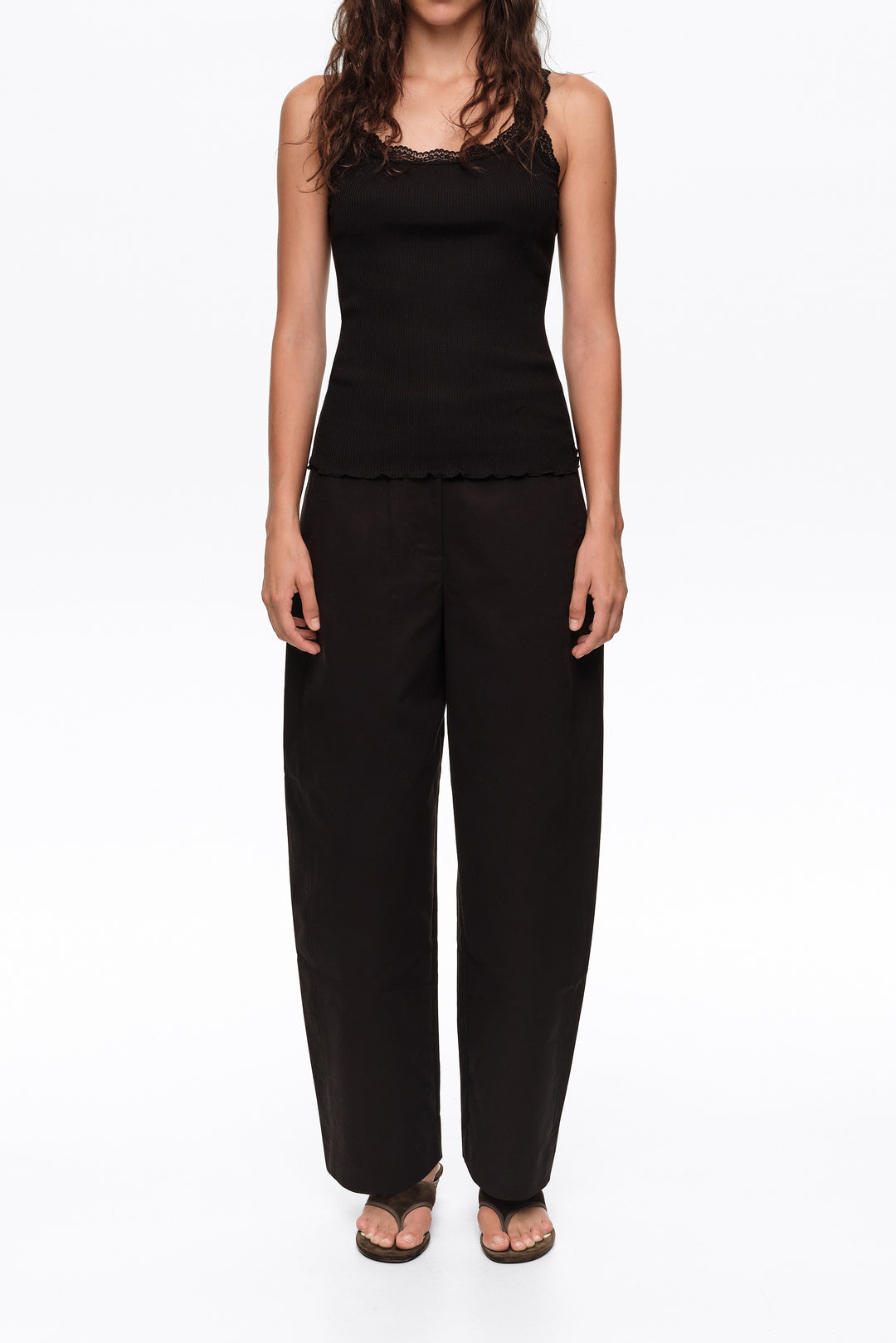 Black barrel trousers with decorative stitching