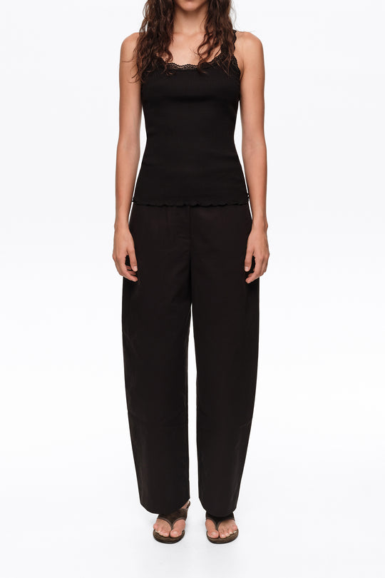 Black barrel trousers with decorative stitching