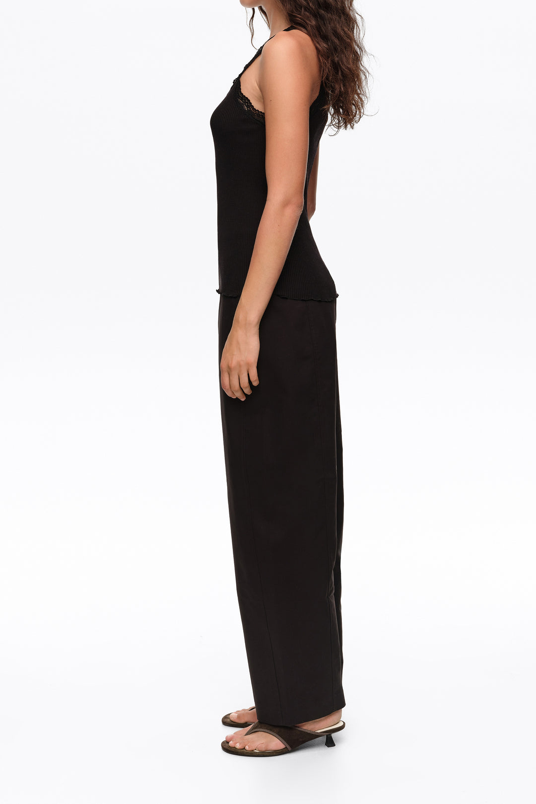 Black barrel trousers with decorative stitching