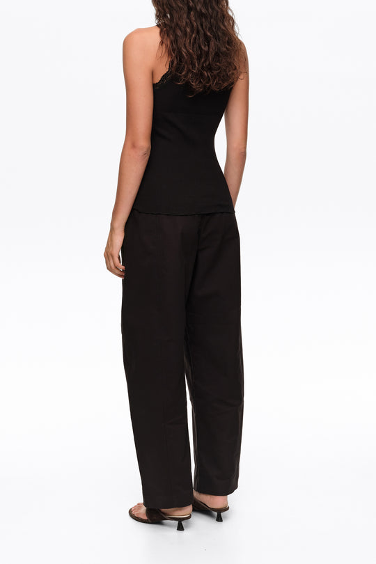 Black barrel trousers with decorative stitching