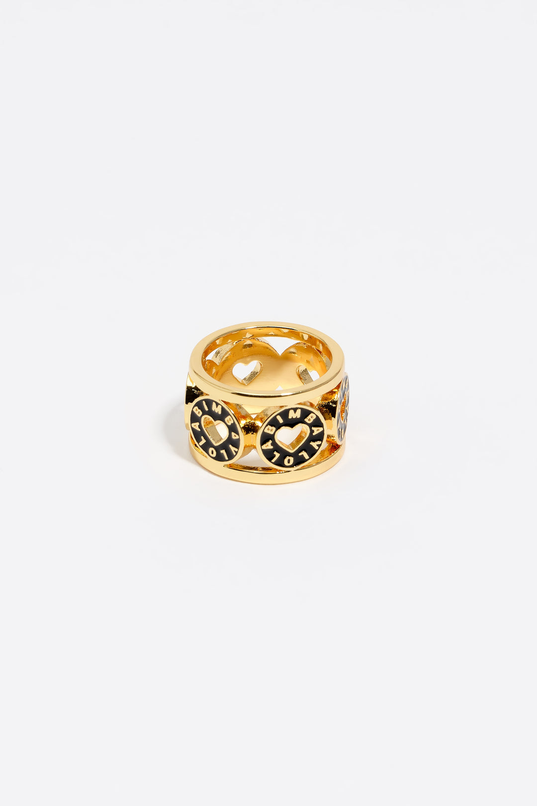 Gold-tone metal ring with black heart logo