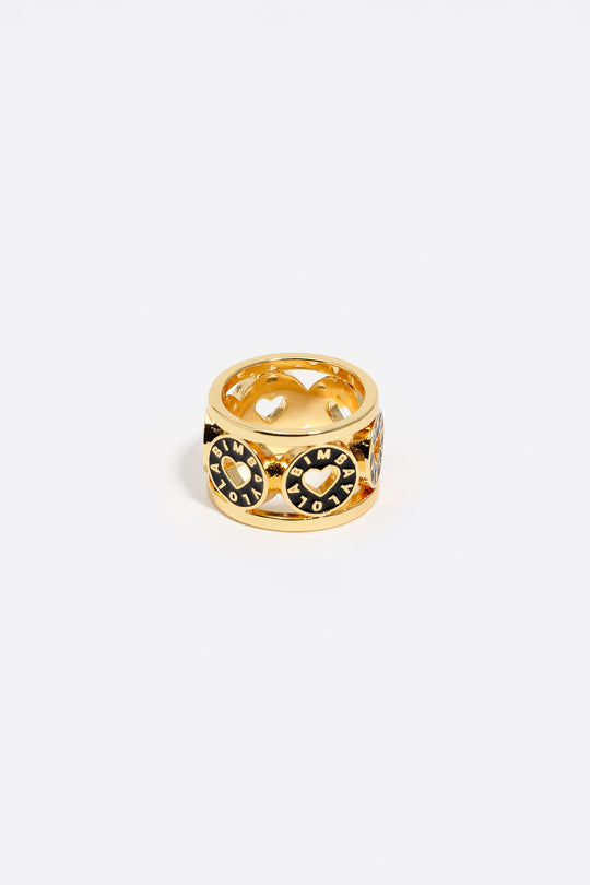Gold-tone metal ring with black heart logo