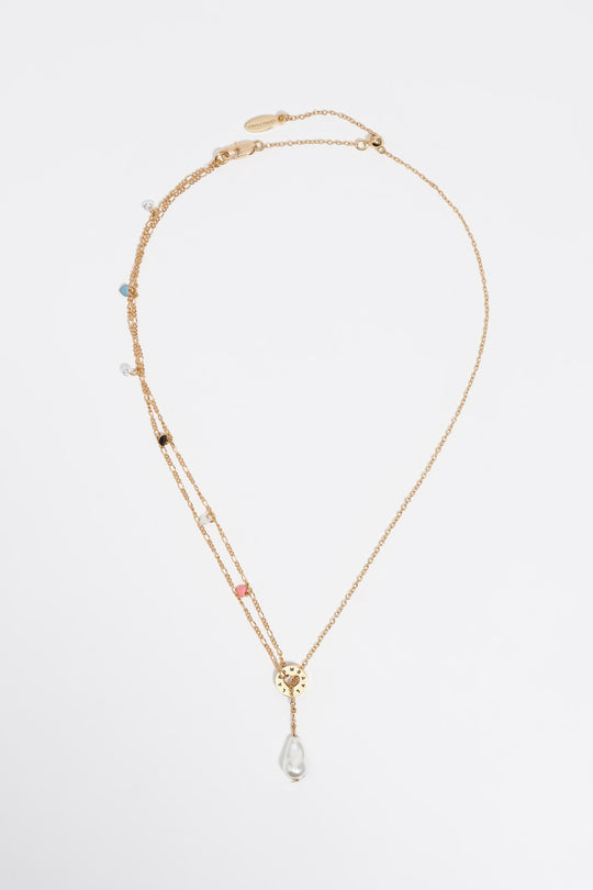 Gold chain and pearl necklace